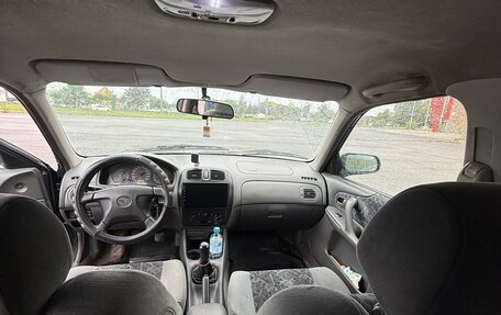 Mazda 323, 1999 год, 175 000 рублей, 23 фотография