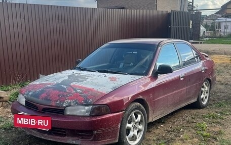 Mitsubishi Mirage VI рестайлинг, 2000 год, 185 000 рублей, 10 фотография